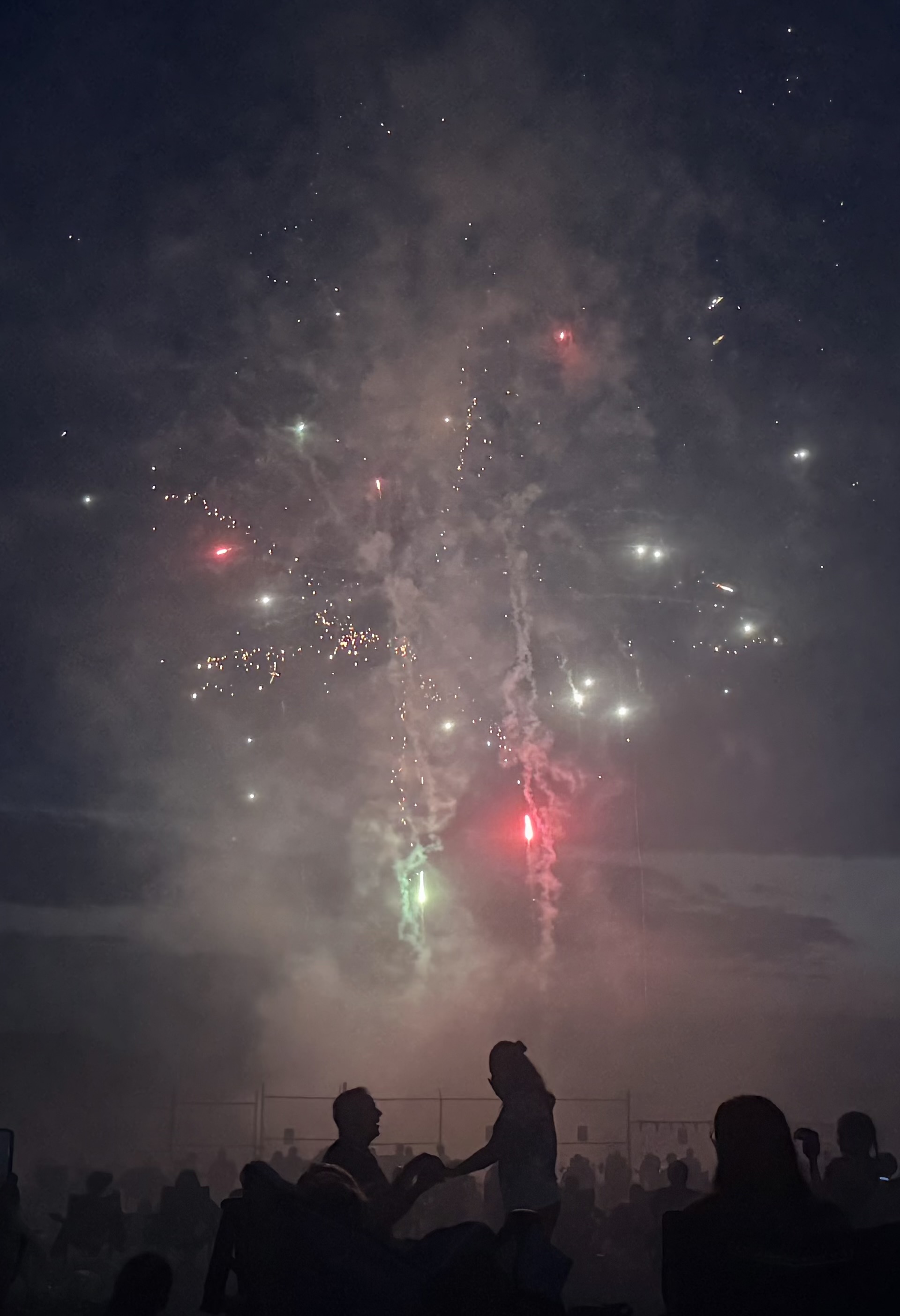 Couple getting engaged during the Hillsboro Fourth of July fireworks show