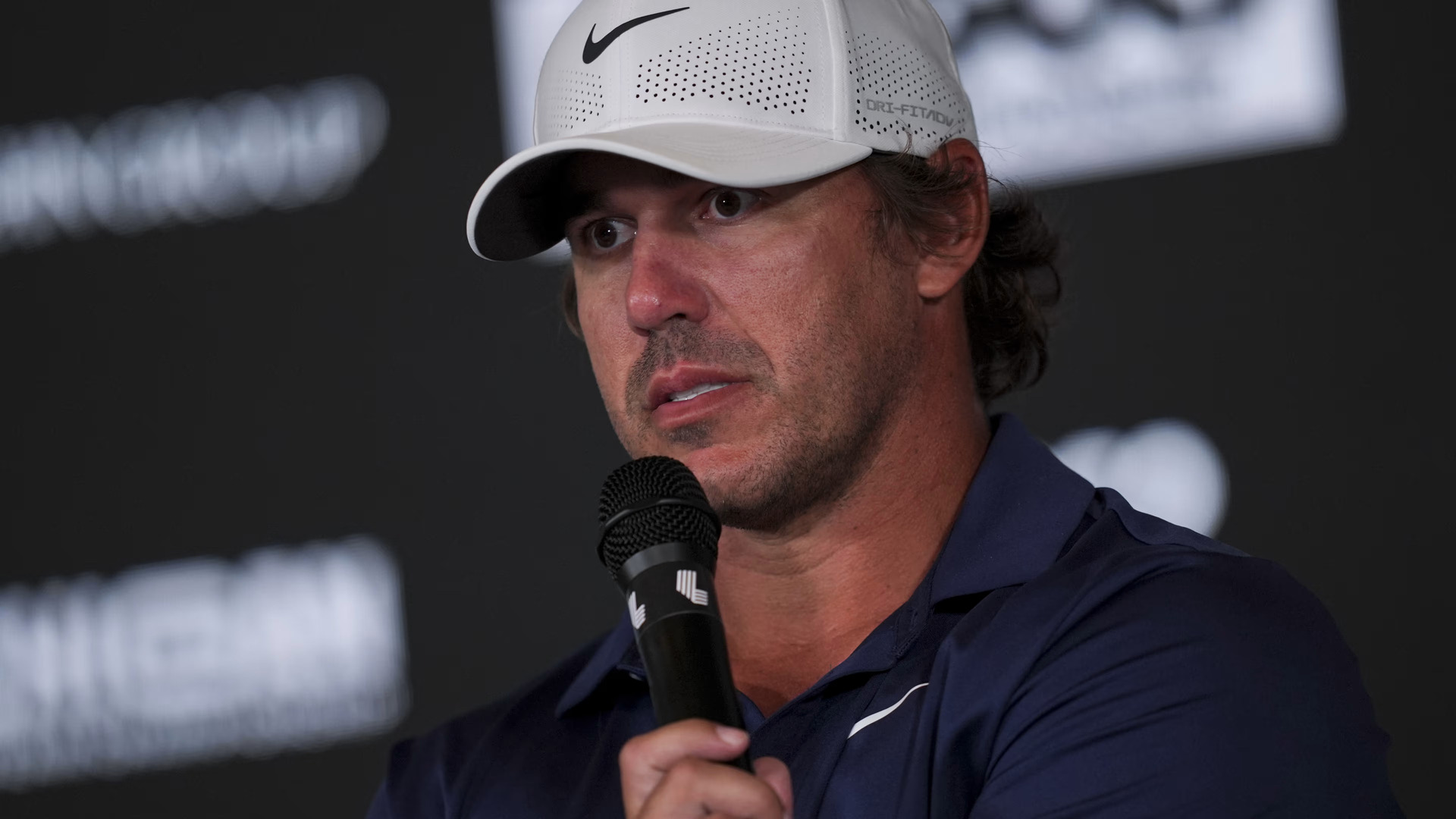 Brooks Koepka answering questions during a press conference amid LIV rumours