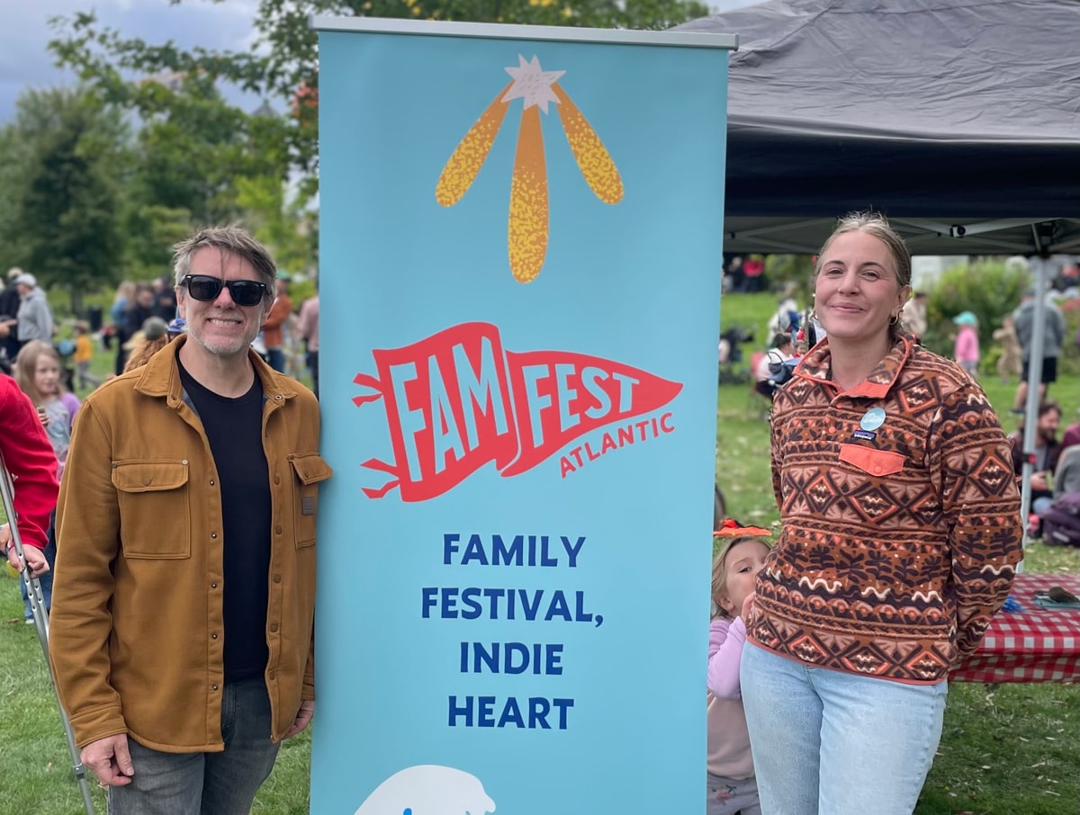 Craig Mercer and Allegra Swanson beside a FamFest Atlantic banner.