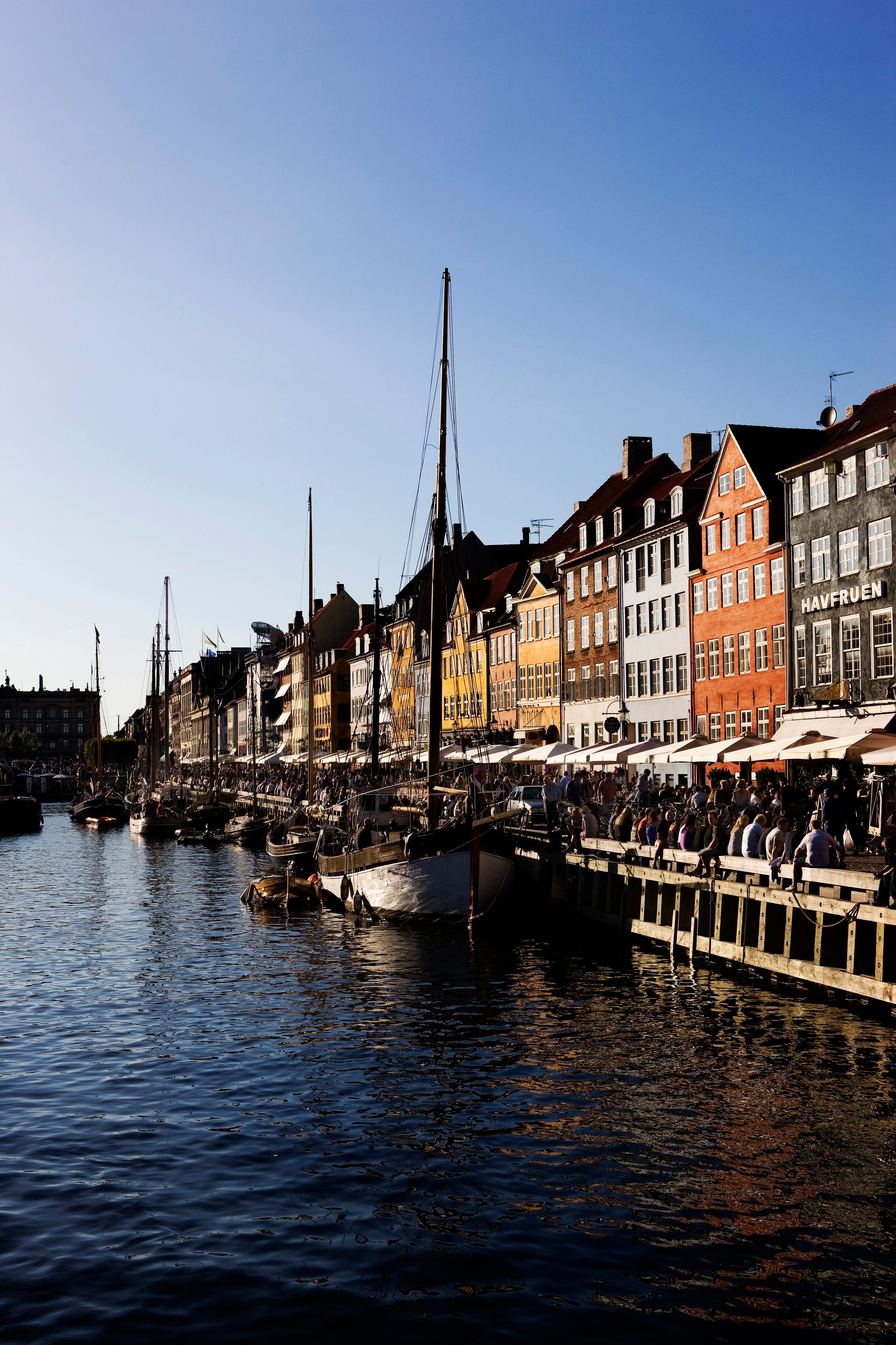 Colorful historic buildings and boats along Copenhagen's Nyhavn waterfront
