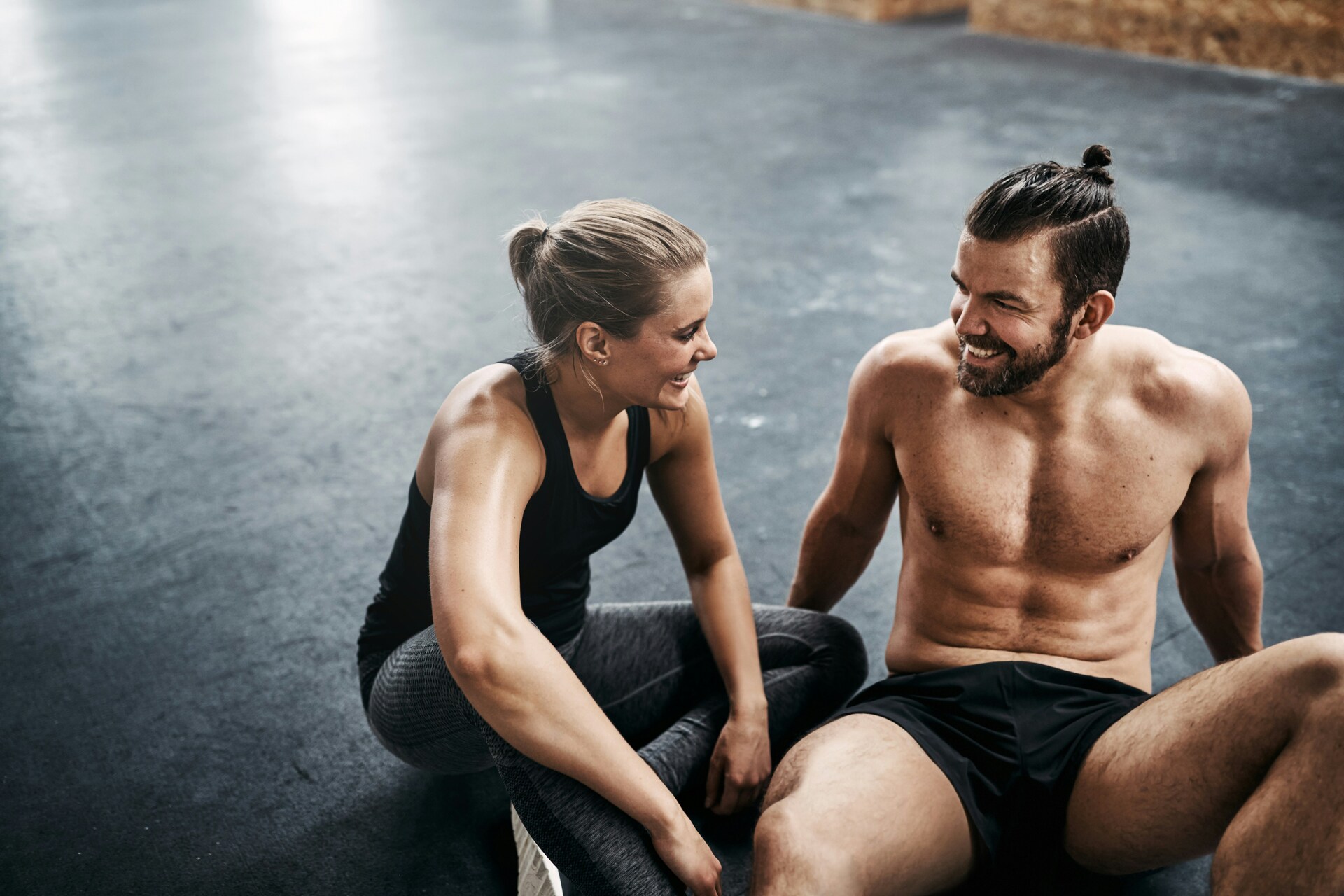 A couple moving in sync during a workout, representing physiological alignment and emotional connection.