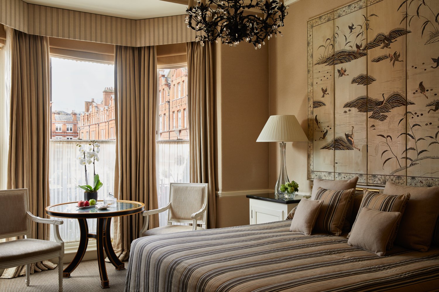 Guest room with a bay window at The Egerton House Hotel