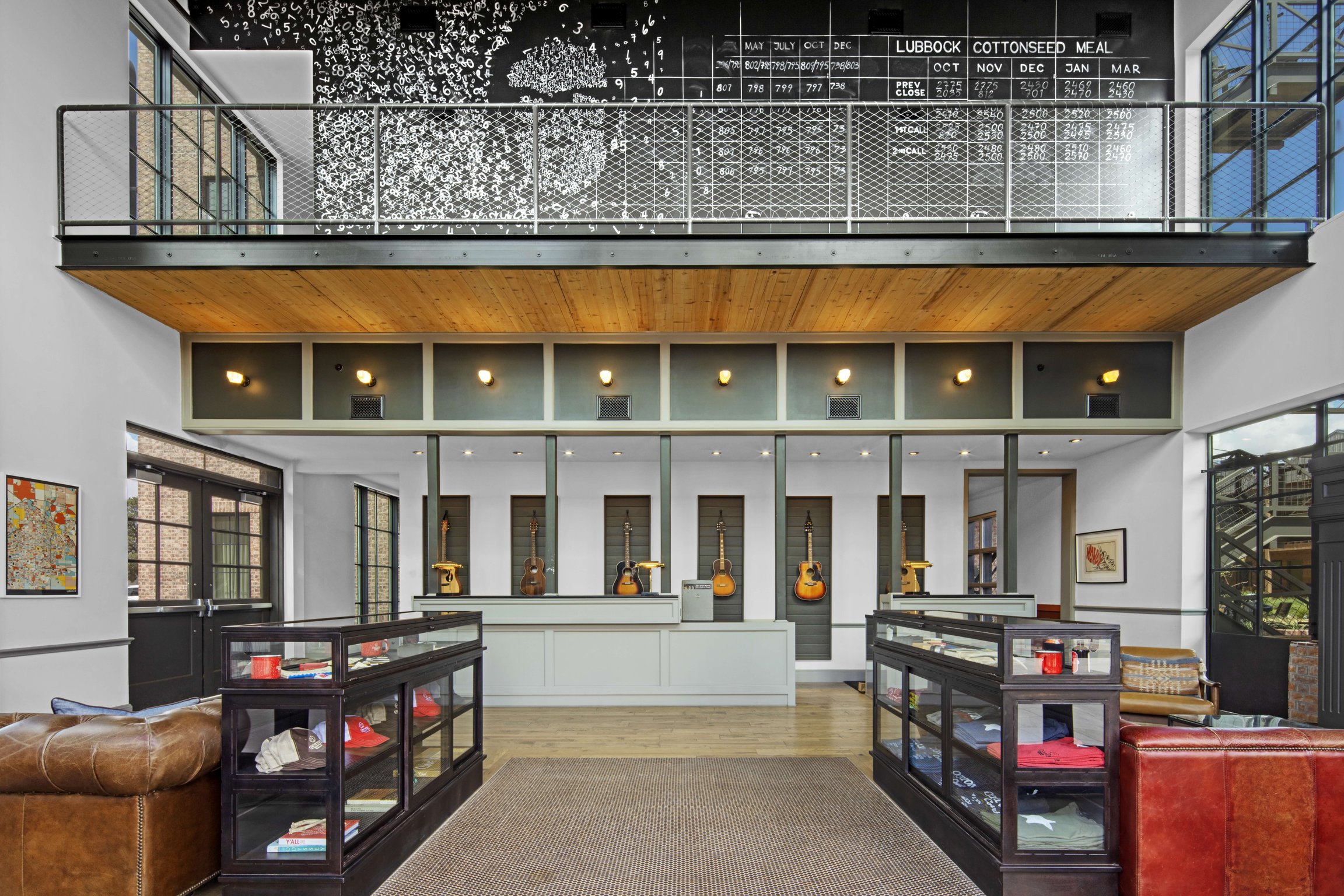 Double-height Cotton Court Hotel lobby with a Buddy Holly portrait
