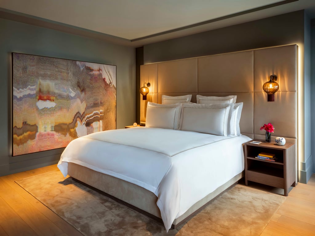 Guest bedroom with an abstract painting above the bed