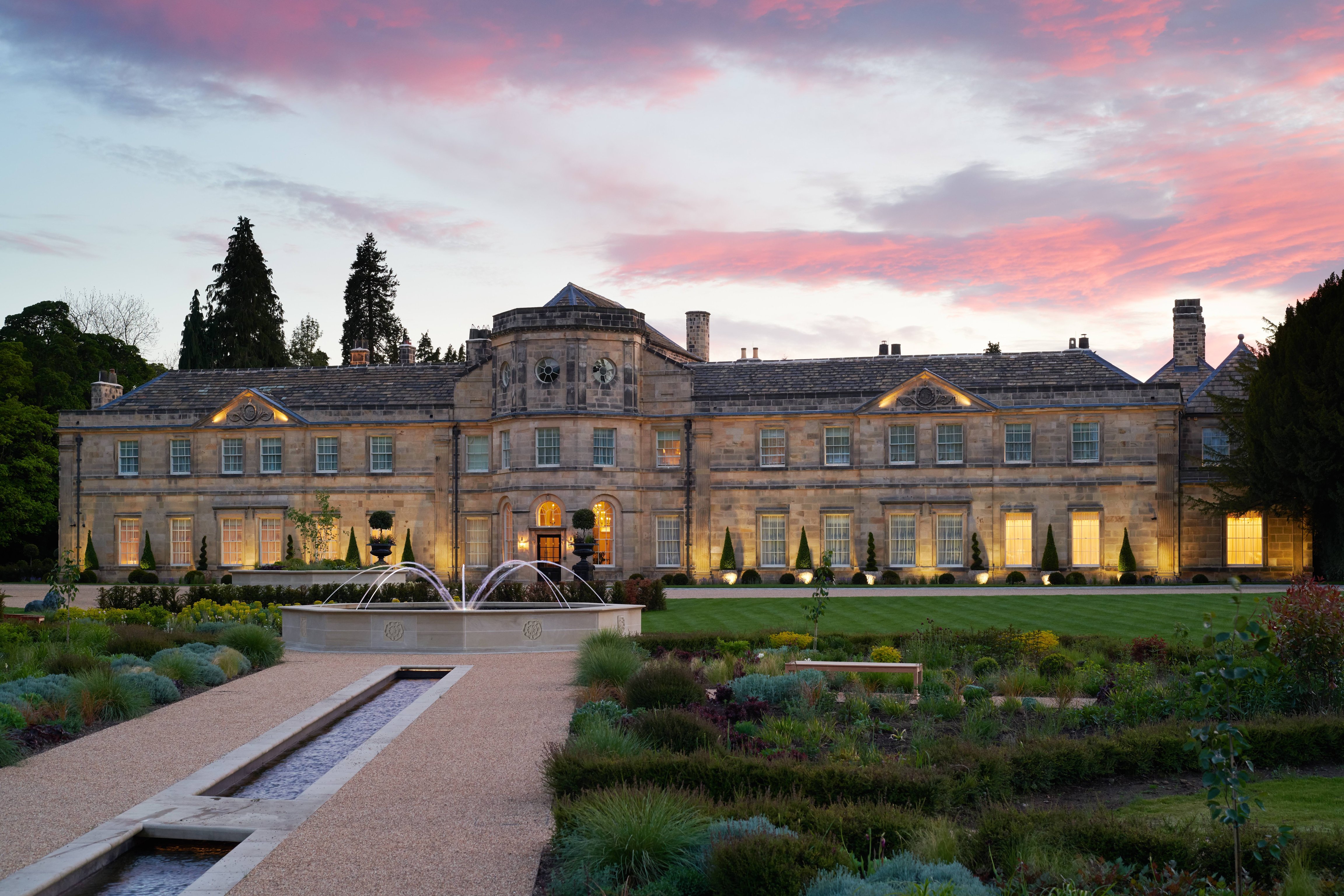 Grantley Hall’s historic facade at dusk