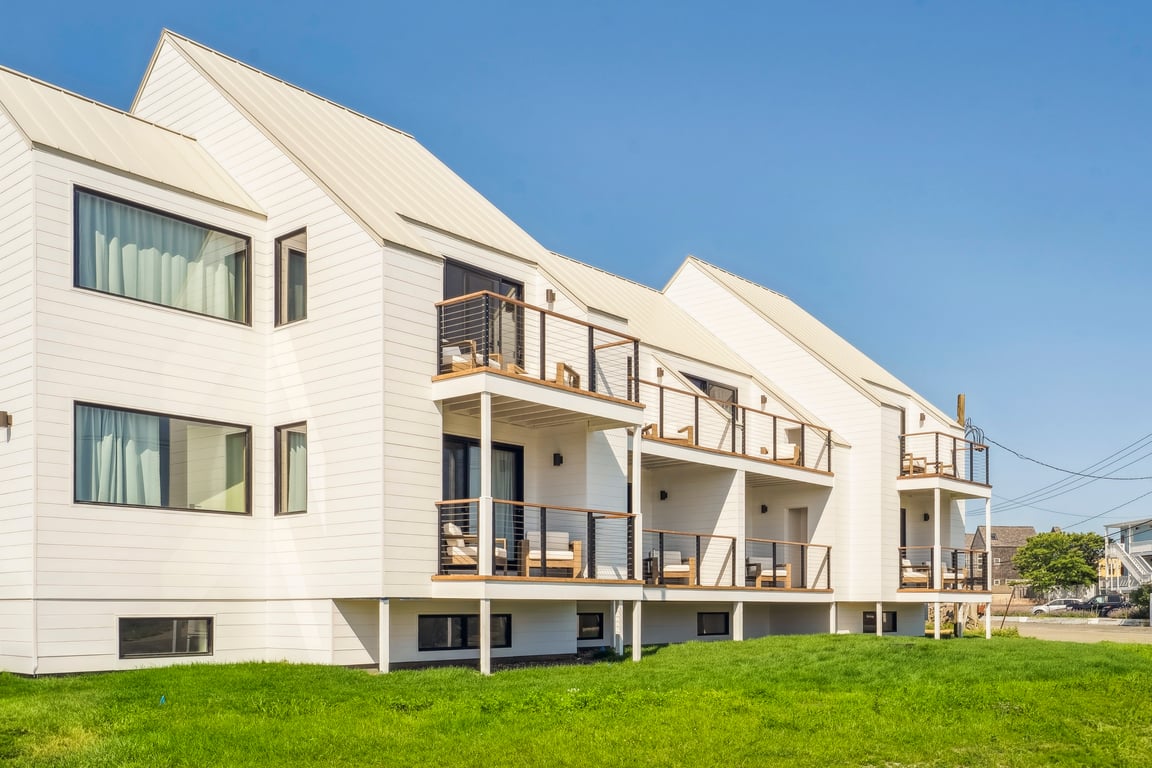 White shingled Offshore Montauk exterior beneath a blue sky