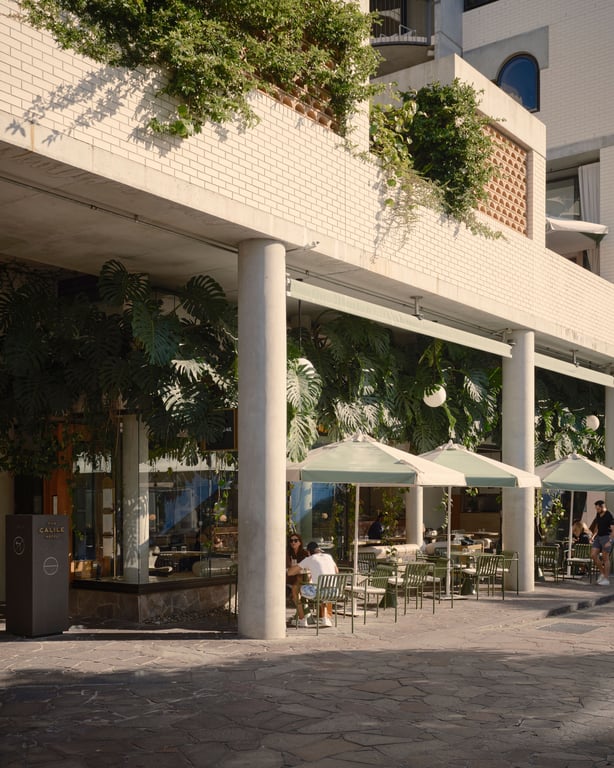 Shops and planted balconies along The Calile Hotel’s street frontage