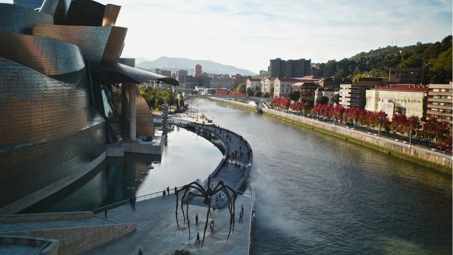 The Guggenheim Museum and Louise Bourgeois spider sculpture beside the river in Bilbao, Spain