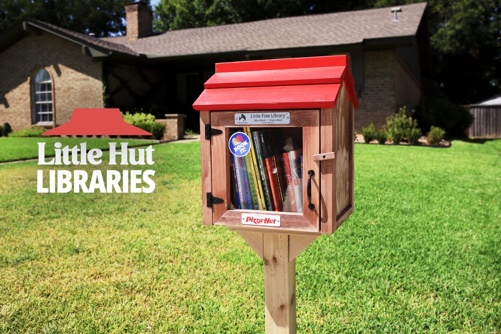 A Little Hut Library holds books beneath a miniature Pizza Hut red roof. Image: Pizza Hut, via Franchise Brief.