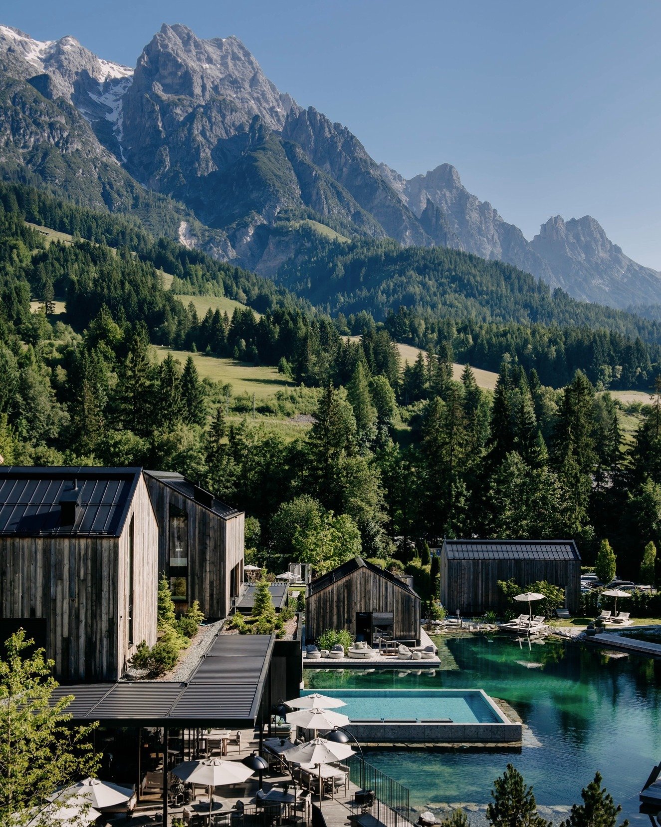 Naturhotel Forsthofgut’s pools beneath the Austrian Alps