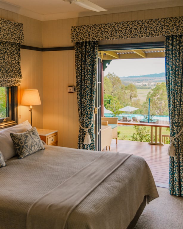Spicers Hidden Vale guest room opening to a veranda and countryside view