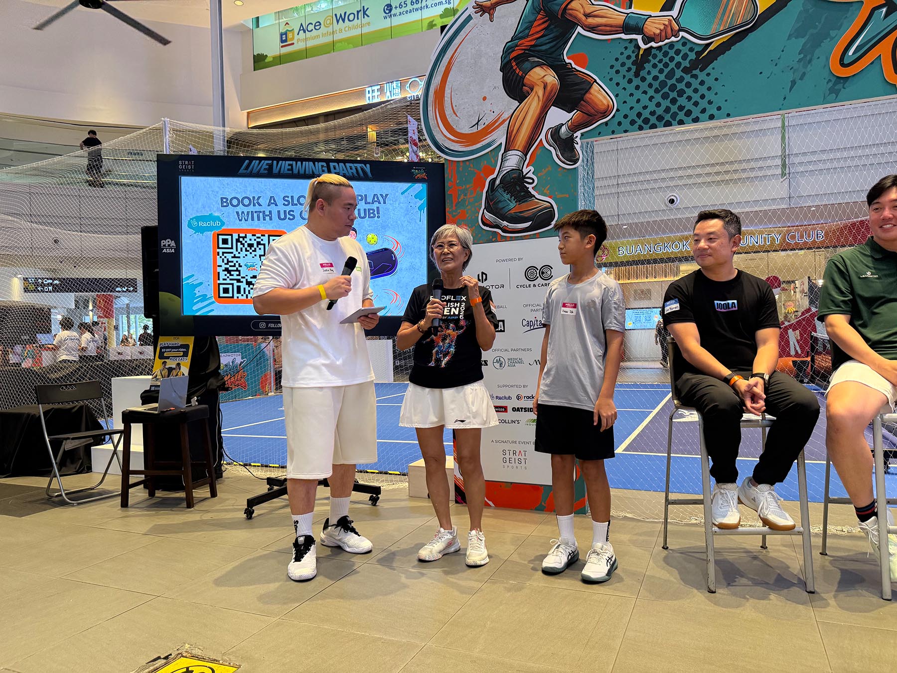 Pickleball Champ Elaine in her 70s, with 11-year old Isaac who's headed to the Pickleball World Cup