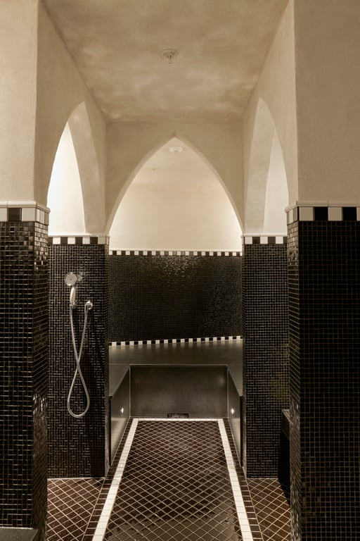 Arched Moroccan-style hammam shower at Nimb's spa