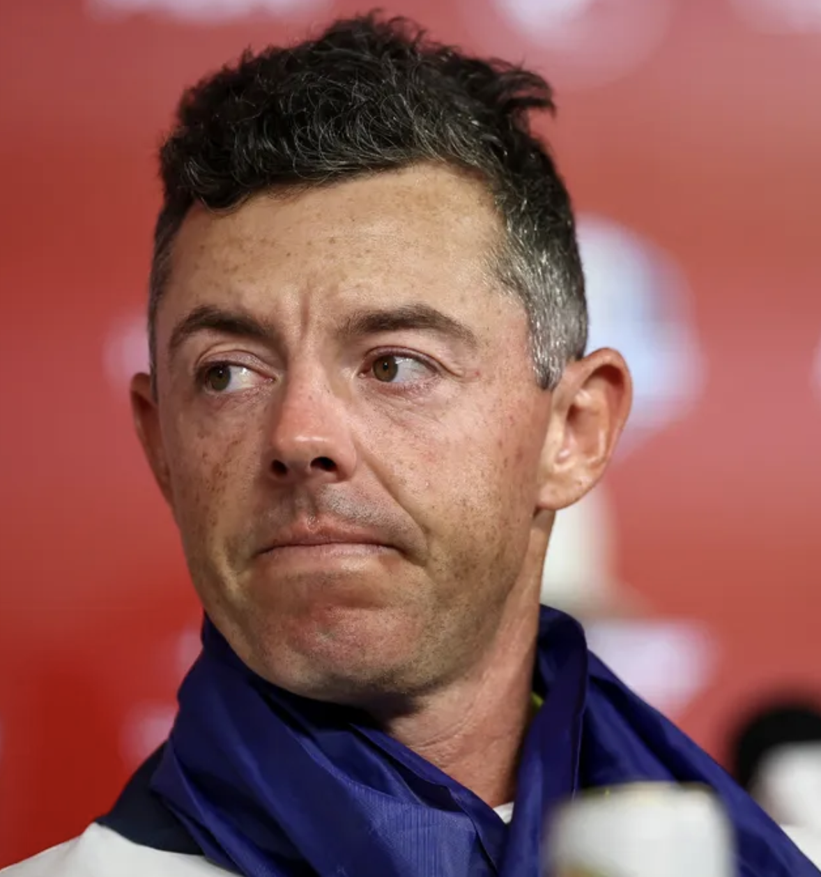 A golfer speaking to reporters, his likeness and voice altered by AI to make it appear he said something he never actually said
