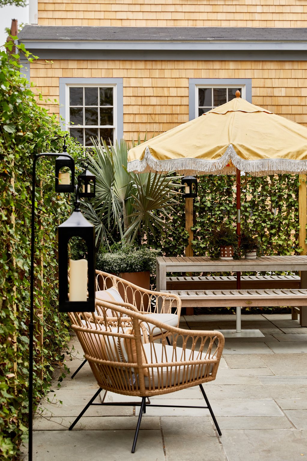 Landscaped Faraway Nantucket courtyard with wicker seating