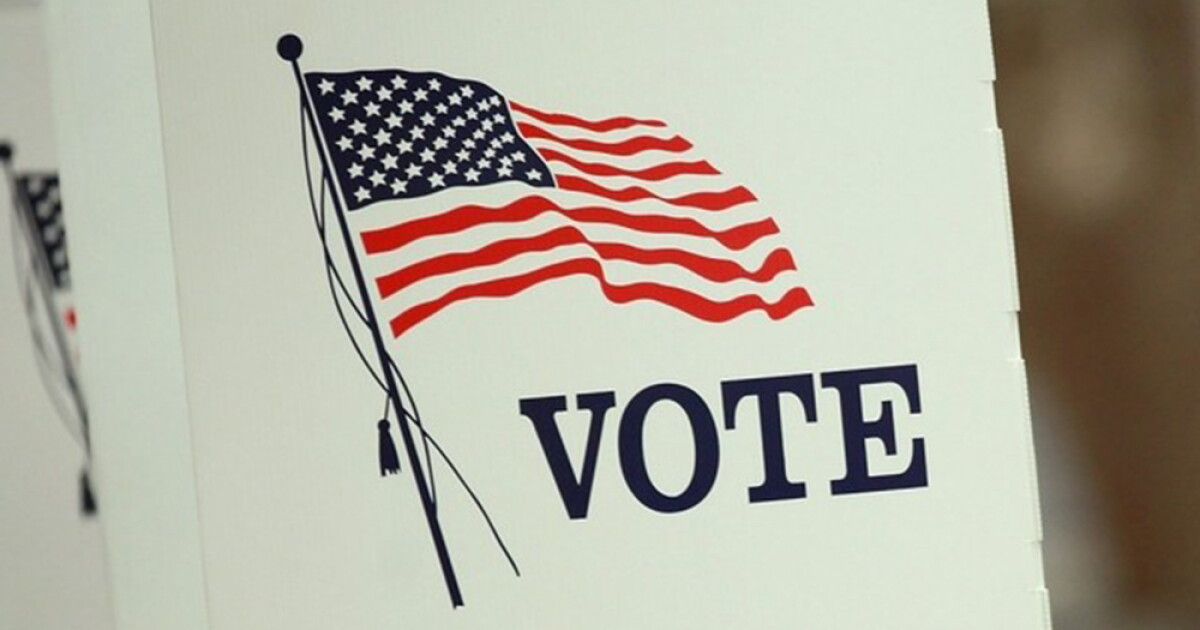 Vote here sign at a polling place