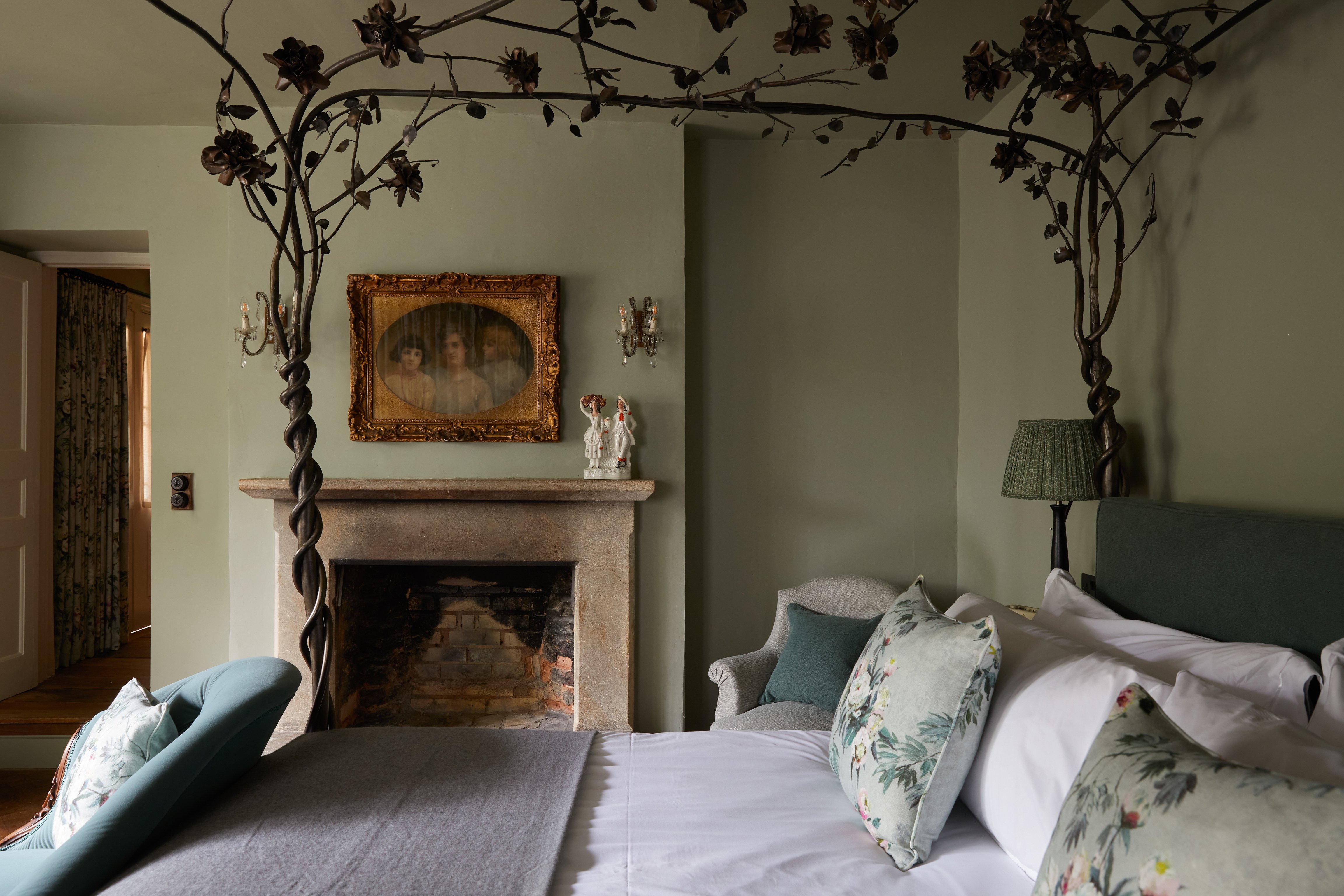 Garden-inspired bedroom and fireplace at The Pig in the Cotswolds