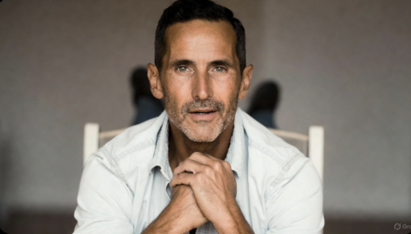 Man seated upright doing gentle spine rotation stretch