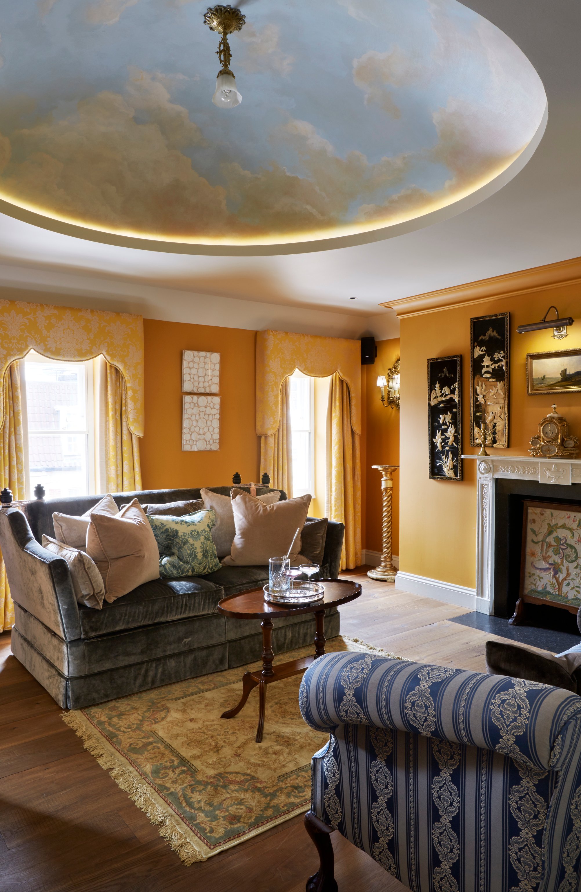 Suite sitting room with a painted ceiling at The Zetter Marylebone