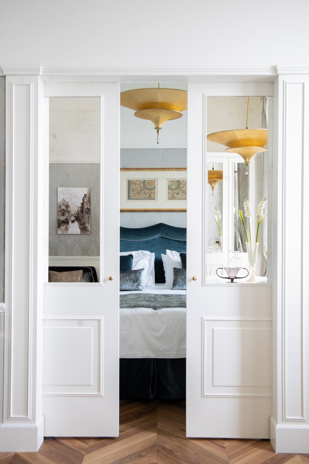 Elegant white paneled doorway opening into a Londra Palace guest room